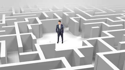 Young businessman standing in a middle of a 3D maze
