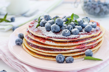 Vintage pancakes outside garden with blueberries