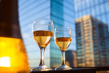 Pair of wine glasses in a city restaurant. 