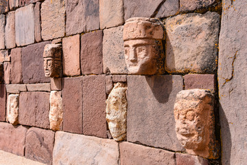 Closeup of a carved stone tenonv head embedded in wall of at the Tiwanaku UNESCO World Heritage Site near La Paz, Bolivia