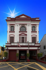 Historic firefighter barrack, one of the first barrack on the island, in the George town city in positioned to intervene with the doors opened and equipment ready 