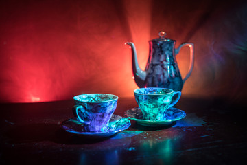 Food background tea and coffee theme. Old vintage ceramic tea or coffee pot with cups jug and sugar...