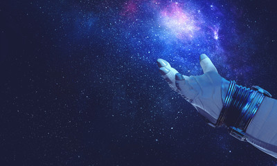 Obraz na płótnie Canvas Hand of spaceman. Mixed media