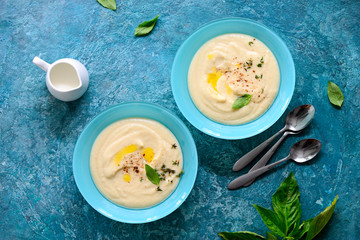 Cauliflower creamy soup, overhead view
