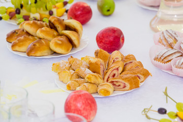 Served tables at the Banquet. Desserts, fruit and pastries on the buffet. Catering.