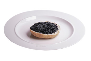 black caviar sandwich on a plate