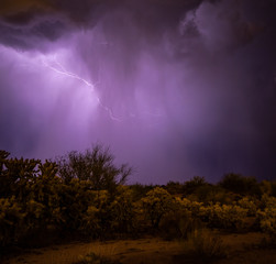 Monsoon storms in the Sonoran desert near Phoenix, Arizona causes lightening, misty, swirling clouds and a stormy look and feel to the desert