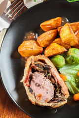 Pork tenderloin in wellington style in puff pastry