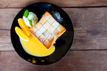 Brick toast with fresh orange and whipped cream