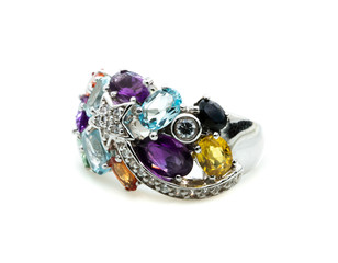 Ring with differet color gemstone on whit background