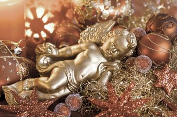 Elegant christmas decoration with cherub copper colored, perfect for christmas cards and holiday decoration
