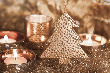 Elegant christmas decoration and candles copper colored, perfect for christmas cards and holiday decoration