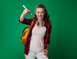 happy young student woman writing in air with big pen