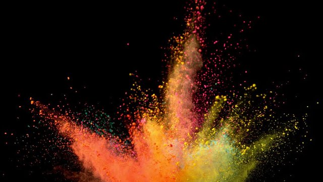 Super slowmotion shot of color powder explosions isolated on black background. Shot with high speed cinema camera at 1000fps