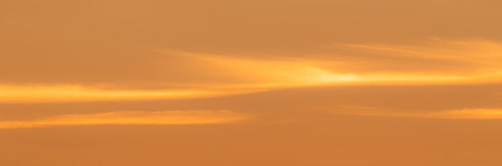 Panoramic - Background of orange sky with soft clouds
