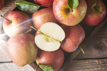 Fresh Juicy Ripe red apples on table