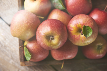 Fresh Juicy Ripe red apples on table