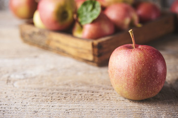 Fresh Juicy Ripe red apples on table
