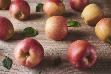 Fresh Juicy Ripe red apples on table