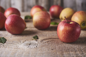 Fresh Juicy Ripe red apples on table