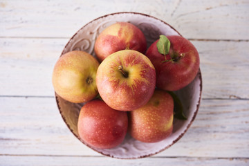 Naklejka na ściany i meble Fresh Juicy Ripe red apples in bowl