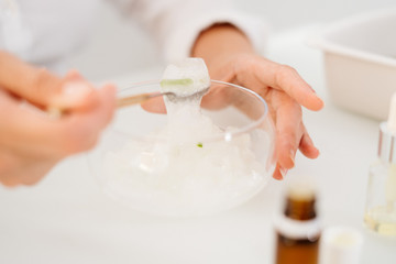 Woman preparing an aloe vera gel recipe with essences. Healthy, natural and cosmetic concept