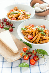 Penne pasta in tomato sauce with basil