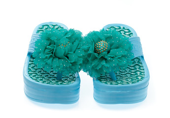 Blue flip-flops with flowers isolated on white background
