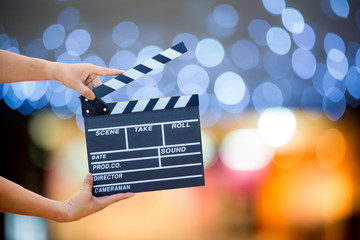 Man hands holding movie clapper.Film director concept.camera show viewfinder image catch motion in...