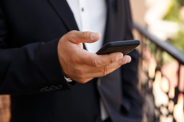 Man with smartphone. Businessman using a smart mobile phone