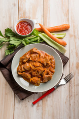 meat stew with tomatoes carrots and leeks