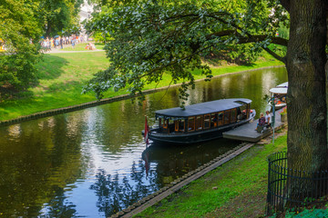 Obraz premium 18.08. 2018 The Kronvalds Park, Riga, Latvia. Urban park with a canal, seasonal boating, plus paths, fountains. One of the most favorite recreation places of Riga. Sightseeing in Riga.