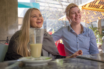 twenty something lesbian couple embrace