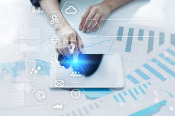 Business and technology concept. Graphs and icons on virtual screen.