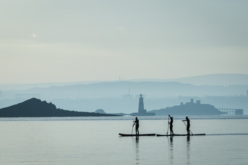 Stand up paddle boarders in Scotland