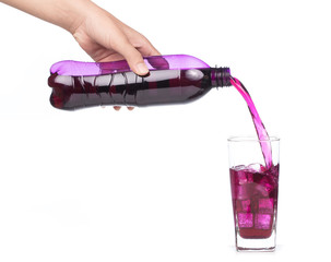 hand pouring refreshing grape drink to glass isolated on white background