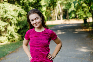 Portrait of woman exercising in park