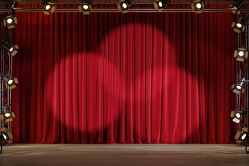 Empty theater stage with red velvet curtains and spotlights. 