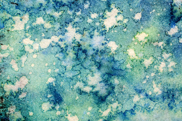 Abstract Blue and Green Ink Stains on Textured Paper
