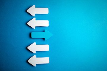 white arrows on a blue background. leadership purposefulness self-development concept