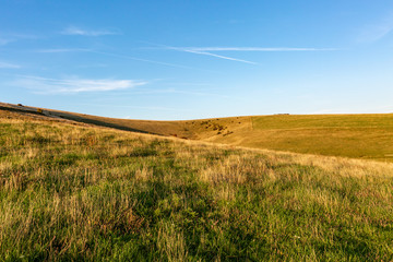 Fototapeta na wymiar Green fields and hills near Lewes, in Sussex, on a late summer's evening