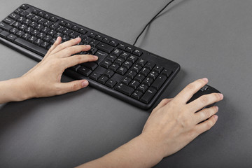 female hands on the keyboard