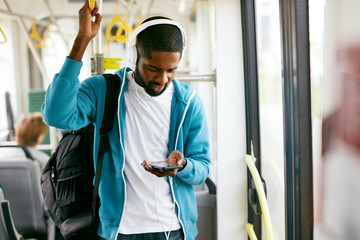 Man Using Phone, Listening Music Traveling In Train