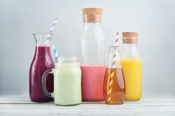 Orange, green and red colored smoothies