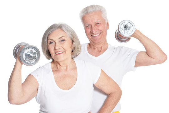 Portrait of a smiling senior couple exercising