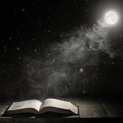 projector shines on the book on the table