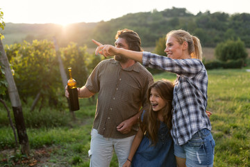 Winegrower family tasting wine