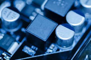 selective focus effect and macro view of the group of electronic components on mainboard circuit board