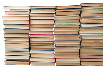 Stack of artistic old books stacked and isolated on white background