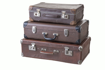 set of three fashionable vintage suitcases of different size, isolated on white background